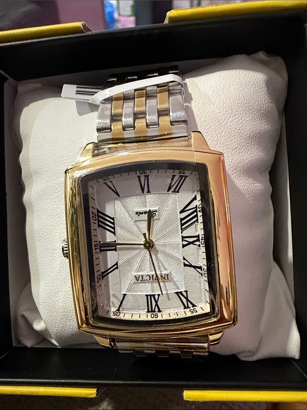 This is the Invicta Celestial Draco two-tone rectangular wristwatch.
